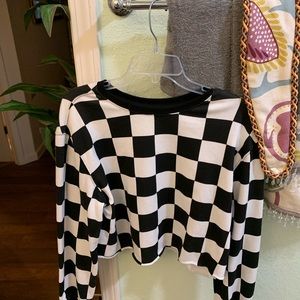 Checkerboard pattern long sleeve shirt.